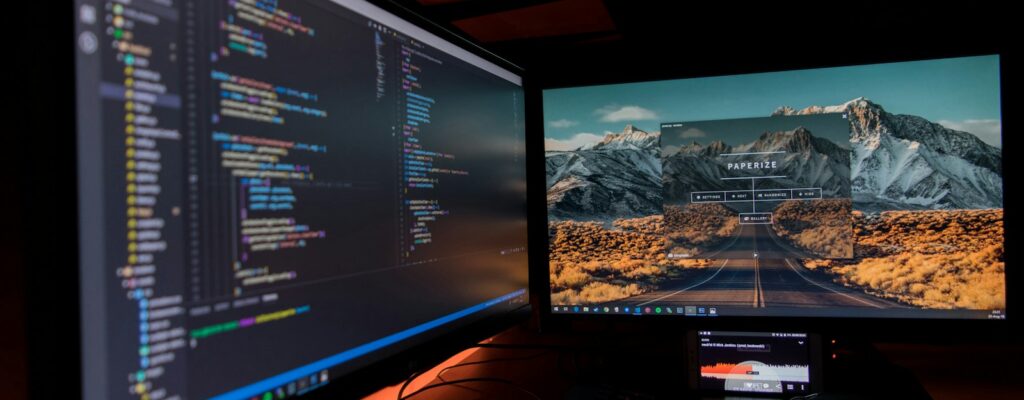 two black flat screen computer monitors